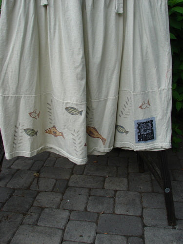 1999 NWT Tadpole Jumper Single Stripe Pike Natural OSFA: Organic cotton jumper featuring fish designs, adjustable shoulder straps, sweeping hemline, and crisscross back with pockets, perfect for expressing individuality.