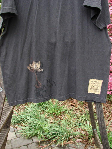 1998 Botanicals Short Sleeved Tee Macro Raven Size 2 featuring a flower design on the front, with a boxy shape, ribbed neckline, and signature Blue Fish patch.