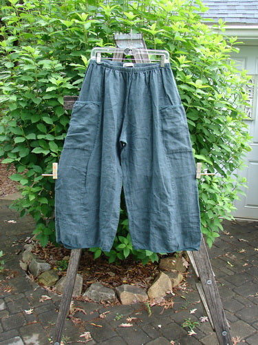Barclay Linen Flutter Top Cargo Pant Unpainted Tealsa Size 1 showcases a relaxed, stylish fit with a thick elastic waist, billowing curved panels, and practical side pockets, epitomizing Bluefishfinder's unique vintage aesthetic.