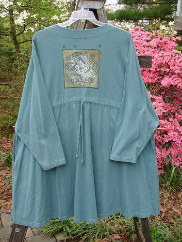 1997 Mask Jacket Quad Celtic Knot Cypress Size 2: Blue dress with a bell shape, two-button closure, deep side pockets, and a rounded swing hemline, featuring a Celtic knot design.