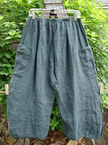 Barclay Linen Flutter Top Cargo Pant Unpainted Tealsa Size 1 features a full elastic waist, billowing fall, curved panels, dimensional widening lowers, two inseam pockets, and slight crop length, ideal for versatile styling.