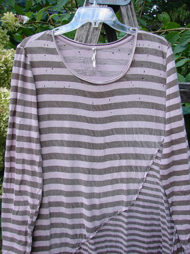 Magnolia Pearl Cotton Dylan Dress Hand Mended Lavender Stripe OSFA displayed on a hanger, highlighting its horizontally striped pattern, diagonal seam detail, and tiny dot accents near the rolled neckline.