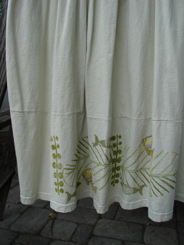 1999 NWT Tadpole Jumper Single Gold Fish Sky Natural OSFA, featuring white pants with green designs, adjustable shoulder straps, sweeping hemline, crisscross back, and round-bottomed pockets. Organic cotton, perfect condition.