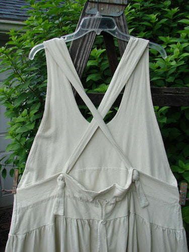 1999 NWT Tadpole Jumper Single Gold Fish Sky Natural OSFA on a hanger, showcasing adjustable shoulder straps, sweeping hemline, drawcord criss-cross back, empire waistline, and round-bottomed pockets.