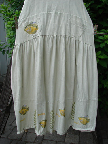 1999 NWT Tadpole Jumper Single Gold Fish Dawn Natural OSFA: Organic cotton white dress with adjustable shoulder straps, sweeping hemline, criss-cross back, gold fish print, round-bottomed pockets, and signature blue fish patch.