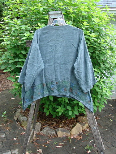 Barclay Linen Tiny Button Dip Side Cardigan Daisy Field Green Mineral Size 0, featuring a deep V-neck, tiny textured buttons, three-quarter pinched sleeves, and a widening vented hemline with side vents.