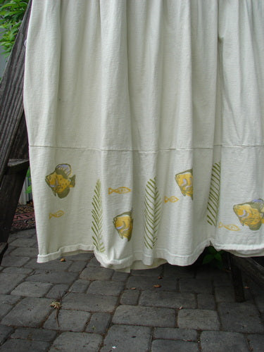 1999 NWT Tadpole Jumper Single Gold Fish Dawn Natural OSFA featuring adjustable straps, sweeping hemline, criss-cross back, empire waistline, round pockets, and gold fish theme. Organic cotton, perfect condition.