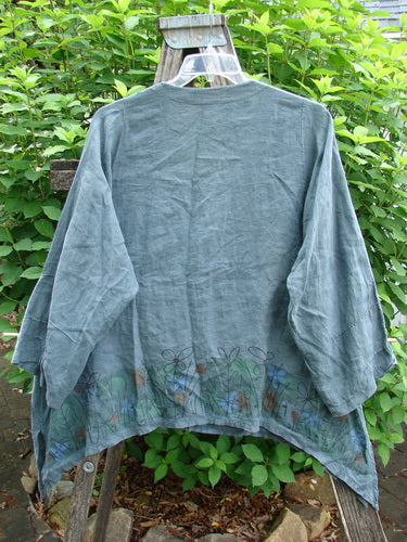 Barclay Linen Tiny Button Dip Side Cardigan Daisy Field Green Mineral Size 0 with a deep V-neckline, textured buttons, vented hemline, and three-quarter sleeves, embodying vintage Blue Fish Clothing style.