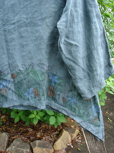 Barclay Linen Tiny Button Dip Side Cardigan Daisy Field Green Mineral Size 0 features a deep V-neck, textured buttons, and vented hem, embodying vintage Blue Fish Clothing's creative individuality.