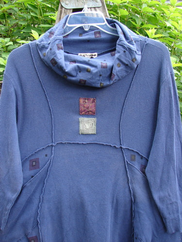 Barclay Patched Thermal Reverse Stitch Pocket Dress in Royal Blue, featuring a cowl neck, exterior stitching, sectional panels, flutter hemline, and painted patches, embodying BlueFishFinder's unique, creative vintage style.