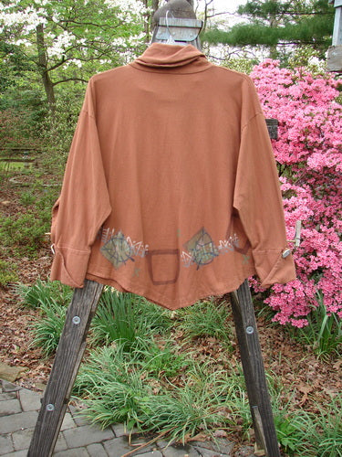 1996 Equilateral Top Primitive Cassia OSFA displayed on a wooden stand, featuring uniquely cuffed double-layered pointed sleeves, a specialized collar, and a dramatic A-line swing.