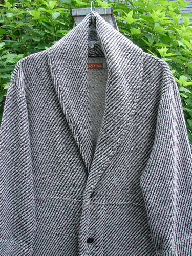 Barclay Patched Wool City Side Big Pocket Coat, featuring a stand-up collar, A-line flair, deep front pockets, sectional panels, and triple button closure, showcased in a black and white stripe herringbone pattern.