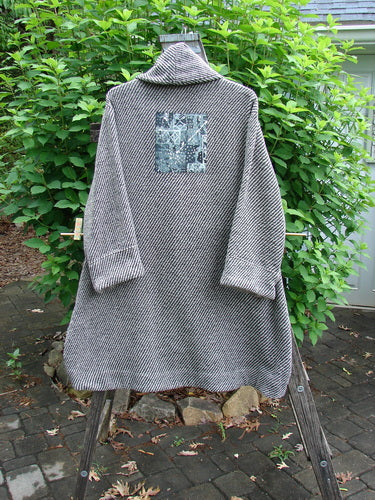 Barclay Patched Wool City Side Big Pocket Coat in Black White Stripe features a stand-up collar, triple button closure, deep front pockets, and an A-line flair, showcasing Bluefishfinder.com's vintage style.