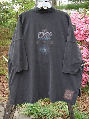 1996 Message Top Turn Path Black Size 3 displayed on a hanger, featuring an abstract design, ribbed mock turtleneck, drop shoulders, oversized front pocket, and varying hemline.