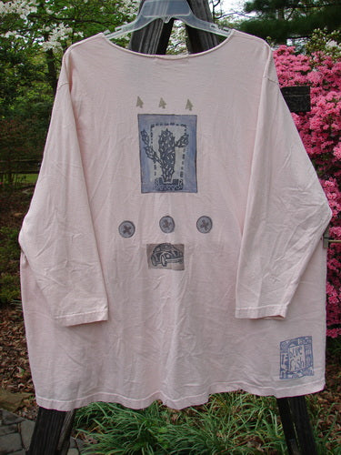 1996 Triangle Cardigan Travel Blue Fish Birch Bark OSFA hanging on a clothesline, showcasing its deep V neckline, scooped hemline, angled front pockets, and signature Blue Fish stamp on the lower back hem.