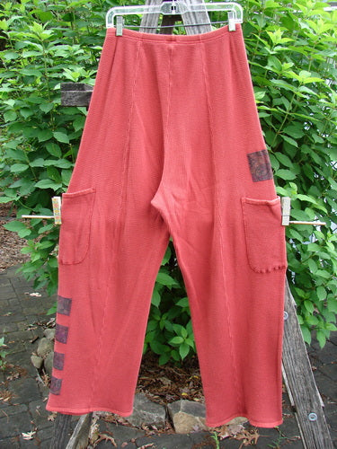 Barclay Thermal Patched Pottery Pant Leaf Sienna Size 1, featuring vertical stitchery, elastic waist, painted leaf patches, deep exterior pockets, and slightly tapered lowers with flat tape accents.
