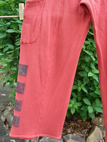 Barclay Thermal Patched Pottery Pant Leaf Sienna Size 1 features a cozy cotton stretch thermal fabric, elastic waist, painted leaf patches, vertical stitchery, deep pockets, and a tapered design.