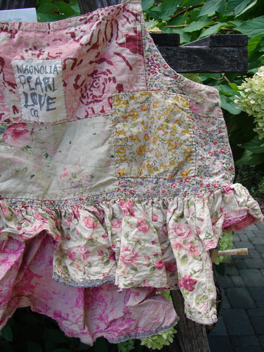 Sleeveless Magnolia Pearl NWT Quilted Catalina Tank Ragdoll Calico OSFA features patchwork floral prints, ruffled skirt, embroidery, and quilting, capturing a vintage aesthetic with hand-mending and distressed accents.