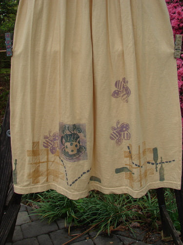 1995 Smocked Skirt Garden Tea Glint Size 2, showcasing intricate smocking, a ruffled top, and a full, flowing hip silhouette, photographed close-up with a hint of plant detail.