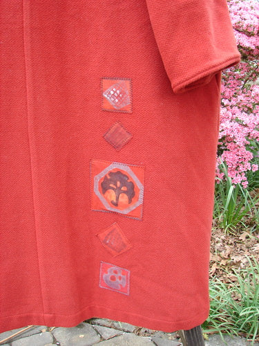 1999 Patched Woven Overcoat Tomato Altered Size 0 featuring hand-blocked patchwork, vintage oversized buttons, and deep inseam pockets, displaying a unique, vintage-inspired design with intricate textile patterns.