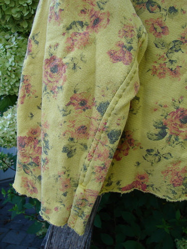 Magnolia Pearl NWT Cotton Fleece Asher Pullover Sweatshirt Vintage Rose Sunnies OSFA draped on wood, showcasing a rose motif, three-quarter zip, raw edges, and signature patch, embodying Bluefishfinder.com's vintage creativity.