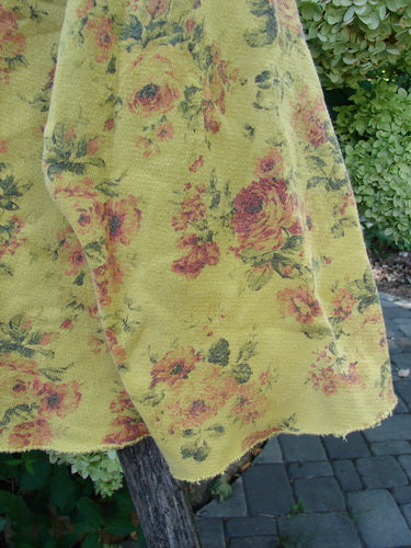 Magnolia Pearl NWT Cotton Fleece Asher Pullover Sweatshirt Vintage Rose Sunnies OSFA displayed outdoors, draped over a wooden rail, showcasing its plush texture and intricate rose pattern detailing.