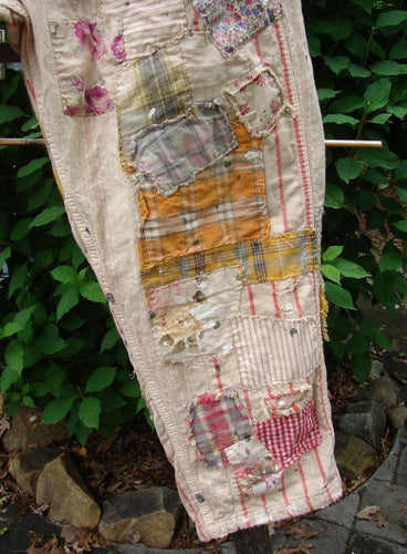 Magnolia Pearl NWT European Cotton Patchwork Miner Jean Encore OSFA features distressed patchwork, adjustable button fly and waist, rear buckle, raw edges, and paint splatters, embodying Bluefishfinder.com's vintage style.