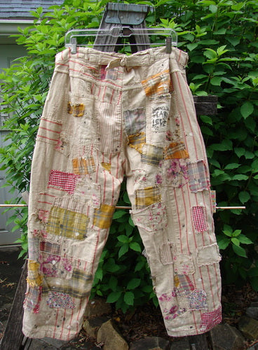 Magnolia Pearl NWT European Cotton Patchwork Miner Jean Encore OSFA features heavy cotton with raw edges, adjustable waist, button fly, rear patched pocket, textured stitchery, and unique patchwork detailing, embodying BlueFishFinder's vintage style.