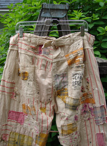 Magnolia Pearl NWT European Cotton Patchwork Miner Jean Encore OSFA features heavy cotton with adjustable button fly and waist, distressed patchwork, raw edges, and textured stitchery, reflecting Bluefishfinder.com's vintage, individualistic style.