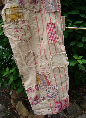 Magnolia Pearl NWT European Cotton Patchwork Miner Jean Encore OSFA features adjustable button fly and waist, varied patchwork, distressed raw edges, and signature detailing, embodying Bluefishfinder.com's vintage, creative expression ethos.