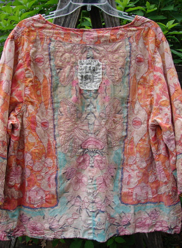 Magnolia Pearl Embroidered Axel Jacket Festive Floral Sunset OSFA made from medium-weight European cotton, features intricate embroidery. Tailored for a relaxed fit, it embodies Bluefishfinder.com's vintage-inspired, creative expression ethos.