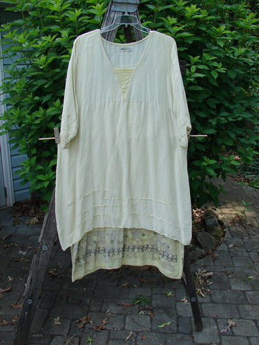 Barclay Hemp Silk Triangular Two Tier Dress Star Wind Citron Size 2 displayed on an outdoor swinger, showcasing its unique V neckline, pinched accents, and varying hemline, reflecting Bluefishfinder's vintage style.