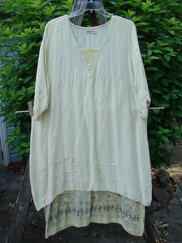 Barclay Hemp Silk Triangular Two Tier Dress Star Wind Citron Size 2, displayed outdoors, showcasing its unique two-tier design, reverse triangle neckline, pinched accents, and varying hemline, embodying Bluefishfinder.com's creative and vintage aesthetic.