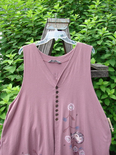 1996 Moonsmile Vest: Swingy and flirtatious piece with tiny buttons, V neckline, a-line shape, curved hemline, side seam pockets, painted rear tab. Adorned in continuous daisy chain theme with ladybug accents. Bust 50, Waist 56, Hips 60.