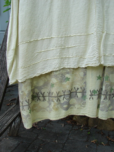 Barclay Hemp Silk Triangular Two Tier Dress Star Wind Citron Size 2 with a two-tiered design, reverse triangle neckline insert, pinched accents, and varying hemline, showcasing intricate textile details.