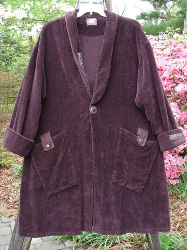1999 Patched Chenille Angle Pocket Jacket Deep Burgundy Size 0 displayed on a swinger, highlighting its oversized vintage button closure, folded collar, and diagonal oversized pockets.
