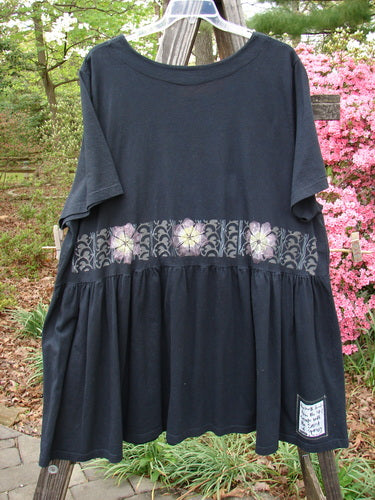 2000 Rosalee Dress Daisy Row Black Size 2 with floral design, slightly dropped gathered waistline, sweeping lower hem, and scooped neckline, made from organic cotton.