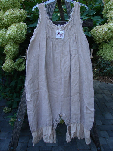 Magnolia Pearl Heavy Gauze Embroidered Signature Farm Love Overall Natural OSFA features billowy bloomer-style legs and wide shoulder straps, hanging outdoors, embodying vintage charm aligned with BlueFishFinder's unique, expressive style.