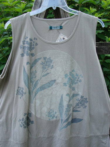 Barclay NWT Flutter Bottom Tank Moon Rock Size 2 on a hanger, showcasing its rounded neckline, slight A-line shape, sweet lower full flutter, and floral moon theme design. Made from lightweight organic cotton.