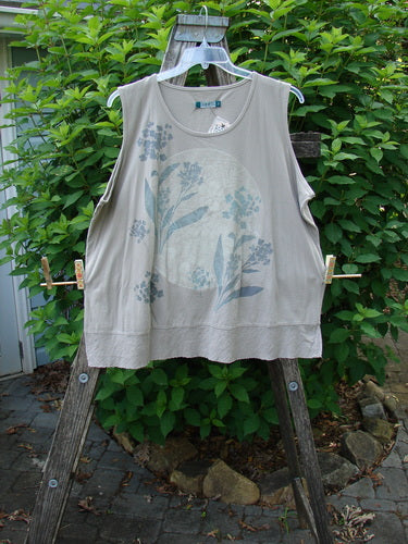 Barclay NWT Flutter Bottom Tank Moon Rock Size 2, featuring a rounded neckline and floral moon theme, displayed on a hanger. The tank has a slight A-line shape with a sweet lower full flutter.