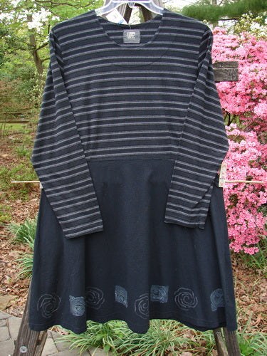 1999 NWT Fitted Circle Dress Wind Turn Black White Stripe Size 2 on a clothes rack, showcasing long sleeves, empire waist seams, and a flared skirt, made from medium-weight organic cotton.