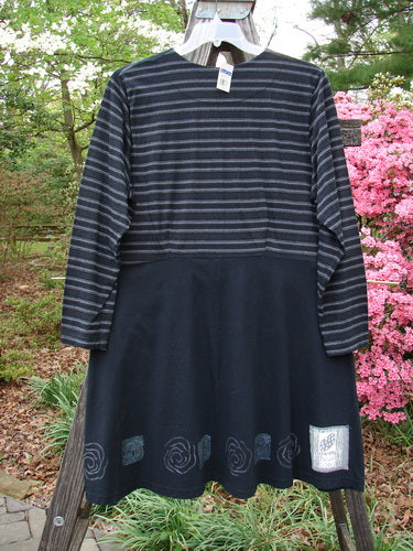 1999 NWT Fitted Circle Dress Wind Turn Black White Stripe Size 2, displayed on a mannequin, features long sleeves, a rounded neckline, and a flared skirt with empire waist seams.