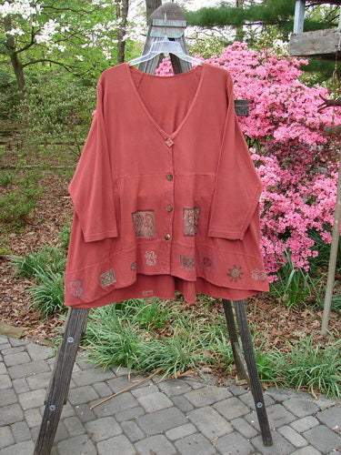 1993 Modernismo Cardigan Growth Woodberry Altered OSFA displayed on a rack, featuring buttons and a classic A-line swing with kangaroo pockets and a drawcord back.
