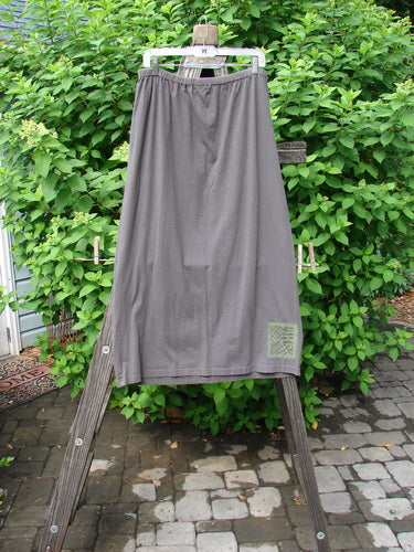 2000 Block Skirt Directional Iron Size 2 displayed on a wooden stand, showcasing its flared lower shape with blended, subtle color changes and a larger elastic waistband.