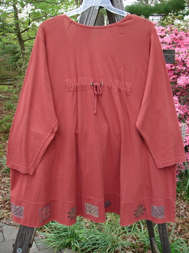 1993 Modernismo Cardigan Growth Woodberry Altered OSFA displayed on a clothes rack, showcasing its wide rounded swing, old-time buttons, and drop kangaroo pockets with a substantial mid-weight cotton jersey fabric.