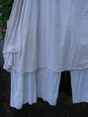 Barclay Gauze Batiste Single Pocket Pant Skirt Unpainted Pink Cloud Size 2 features a flowing gauze overlay with an offset round pocket, enhanced by a distinctive, billowy batiste flare.
