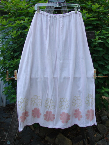 Barclay Batiste Over Skirt Daisy Border Pink Cloud Size 2 features a close-up of the delicate pink floral pattern on the white skirt, highlighting the daisy-themed double row design and sectional panels.