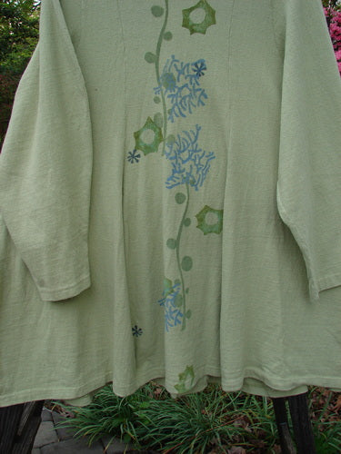 1996 Reprocessed Spring Rain Jacket with coral reef and floral design, featuring long sleeves, deep side pockets, vintage closure, and lower belled side accents, from the Blue Fish Clothing Spring Collection.