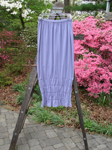2000 Rings of Saturn Skirt Unpainted Twilight Size 2 displayed on a wooden stand, featuring a full skinny larger elastic waistline and tapered lower with detailed stretchy lower smocking.