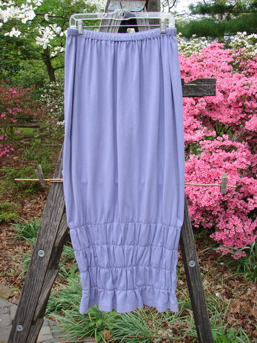 2000 Rings of Saturn Skirt Unpainted Twilight Size 2 displayed on a wooden ladder, showcasing its tapered lower and detailed stretchy smocking, reflecting Bluefishfinder.com's vintage and unique fashion ethos.